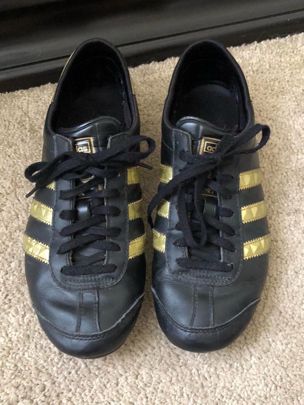 adidas Women’s Black Sneakers with Gold Stripes